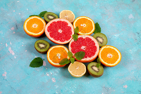 蓝底柑橘 柠檬 葡萄果和石灰的柑橘水果薄荷食物蓝色果汁团体奇异果叶子热带素食主义者柚子图片