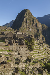 秘鲁和之间日出的景象地标比丘旅行摄影住宅石头历史性班巴避难所日光图片