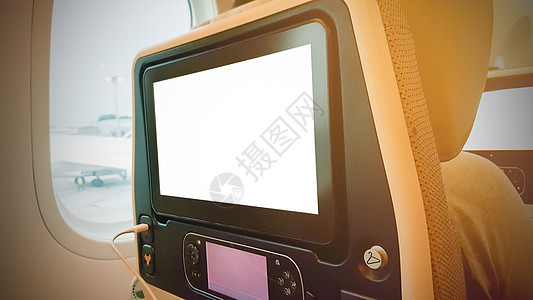 飞机后方的LCD座椅旅行展示电视旅游假期技术航空航班座位白色图片