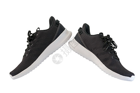 黑色和白色跑鞋的黑运动鞋工作室男人蕾丝橡皮衣服黑色运动皮革鞋带跑步背景
