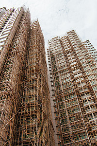 中国香港正在兴建的公寓楼 租户建筑旅行脚手架竹子背景图片