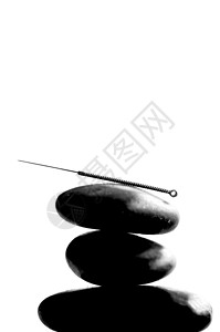 黑色和白色针缝针身体石头康复保健金属宏观卫生中医治疗工具背景