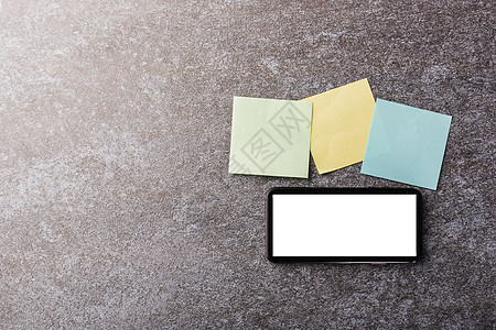 带有现代智能手机的空白纸贴笔记列表互联网屏幕展示技术清单白色桌面桌子办公室工作图片
