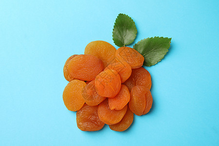 盐酸干杏仁和蓝底叶叶水果团体解雇甜点框架杏子饮食橙子美食叶子图片