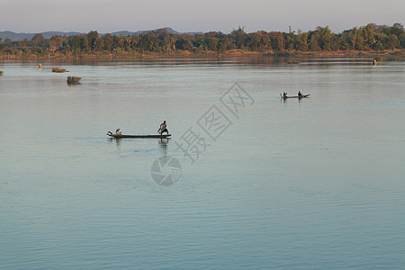 1 12 2012年12月12日日落时湄公河 与渔船和渔网小时钓鱼蓝色太阳传统背景图片