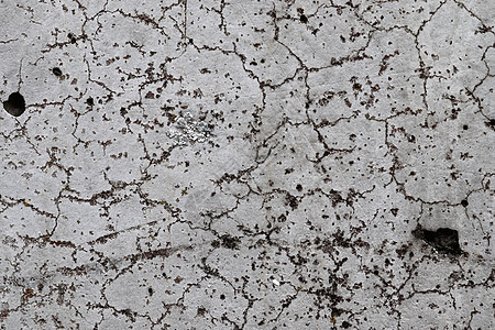 在有裂缝和斜体的老水泥墙上进行详细的近视剥皮材料宏观大理石雇用岩石高分辨率花岗岩石膏插图背景图片