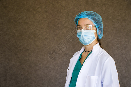 女医生肖像 戴面罩 眼镜 手套和制服的医生女士女性医师情况手术帽药品面具诊所乳胶医疗图片