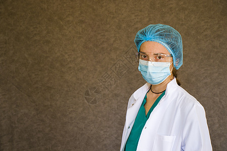 女医生肖像 戴面罩 眼镜 手套和制服的医生乳胶流感面具安全外科手术帽医疗药品防护服护士图片