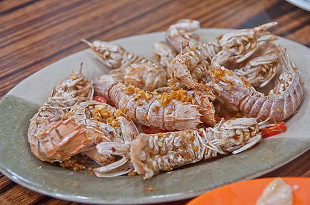 辣椒大蒜干烘烤炒鱼 带海盐的岩石龙虾图片