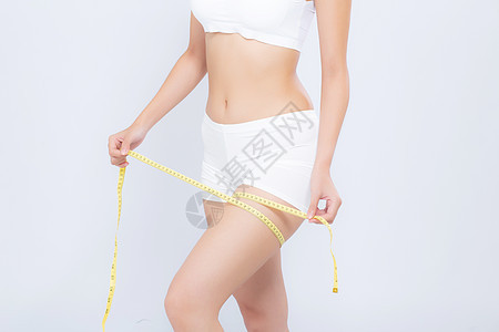 紧闭的天主教大腿瘦瘦和有体量异索拉特的妇女身体腰部健身房皮肤肥胖橘皮女孩数字测量运动女士图片
