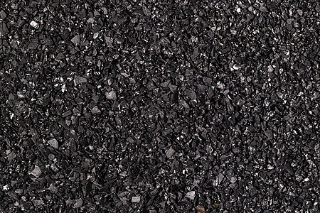 特写活性炭纹理 椰炭粒状粉末活性黑色煤炭清洁酒精吸附剂椰子质地背景图片