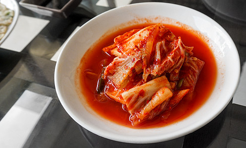 朝鲜方菜由木瓜泡菜制成传统美食萝卜饮食盐渍食物盘子营养烹饪胡椒图片