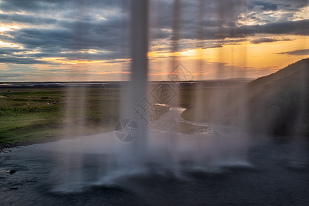 冰岛日落时的塞尔雅兰德弗斯瀑布运动流动力量旅行旅游地标溪流瀑布天空活力图片