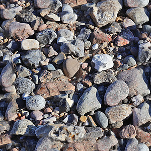 相片现实 无缝的石头和石块纹理图案模式a沙滩花岗岩碎石圆形高分辨率卵石灰色地面鹅卵石矿物图片