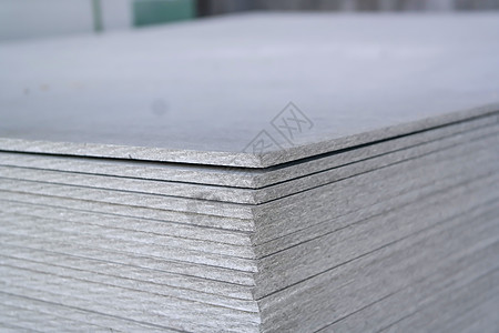 灰色背景图堆叠起来用于房屋建造的石棉水泥板块背景