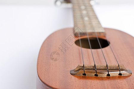 Ukulele 白色背景的音乐乐器民间岛屿吉他棕色物体娱乐指板尤克里里设备水平图片