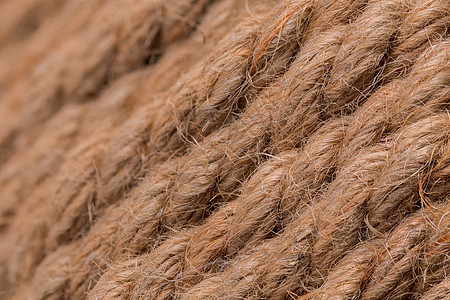 旧米色绳索宏观背景编织领带力量电缆材料航海绑定曲线棉布棕色图片