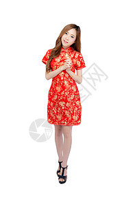 美丽的中国新年快乐肖像 年轻的亚洲女性穿着姿势成人传统微笑祝福快乐旗袍女孩节日裙子图片