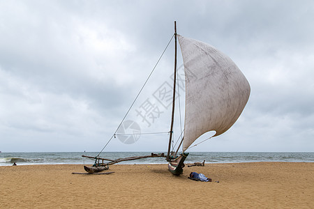 斯里兰卡Negombo海滩上的传统动物园旅游钓鱼吸引力水手渔夫双体海洋支撑海岸男人图片