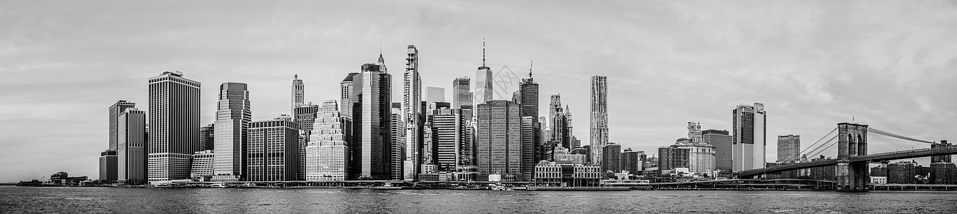 曼哈顿天线 在阴云多云的日子里建筑学大都会景观日落商业旅行天空码头帝国球衣图片