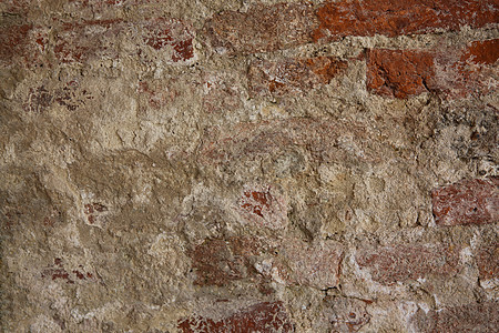 旧砖墙的抽象部分 带有用于复古背景的破旧石膏裂缝石头岩石风化建筑学水泥楼板混凝土古董墙纸图片