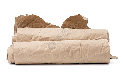 白色背景上孤立的棕色包装纸滚动包装烹饪折叠床单生态工艺材料空白回收食物图片