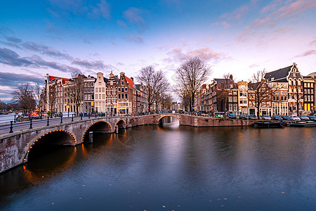 日落时荷兰阿姆斯特丹 日落时古老运河旅游房子建筑物地标历史街道建筑学窗户景观建筑图片