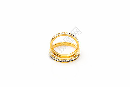 白色背景的黄金结婚戒指钻戒金子订婚宝石新娘金带婚姻婚礼水晶钻石图片