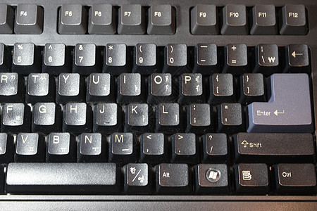 带有白色字母和数字的膝上型计算机键盘黑键的特写塑料电子按钮电脑宏观教育木板语言按键笔记本图片