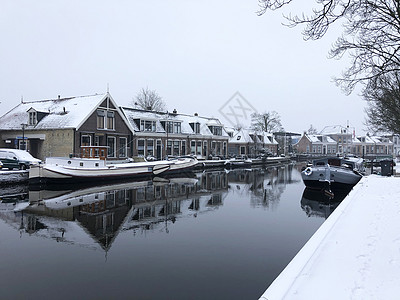 冬天在斯奈克运河周围地标灰色反射建筑学房子多云图片