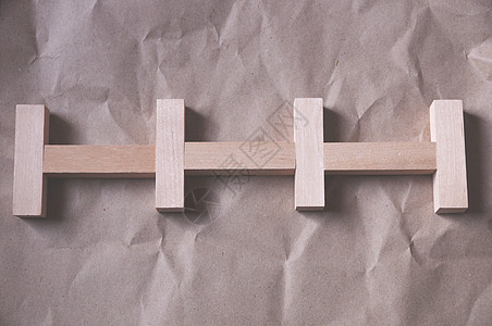皱巴巴的牛皮纸背景 木制矩形按一定顺序排列材料木头木块地面玩具货物模块框架大理石建筑图片