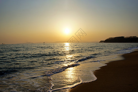 海景美丽 日落在海面上地平线太阳海岸线天空波浪海洋图片