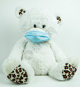 白色背景的蒙面泰迪熊棉布玩具细绳疾病样本防御儿科医疗流感褶皱背景图片