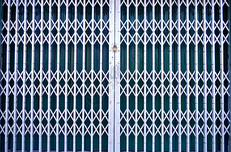 生锈的肮脏的铁 gateAsian 前门背景的难看的东西纹理墙纸金属建筑学镀锌材料栅栏建筑插图入口宏观图片