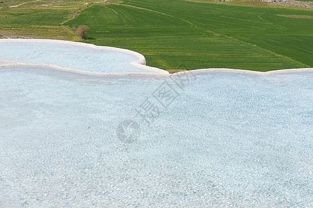 土耳其 Pamukkale 的天然石灰华池和梯田 Pamukkale 在土耳其土耳其语中意为棉花城堡遗产石灰华旅游旅行水池阳台石图片