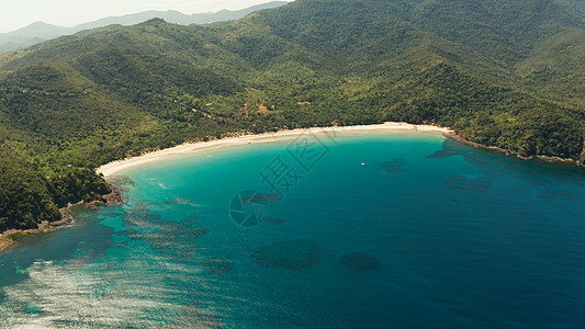 具有蓝色环礁湖的热带岛屿天堂天线旅游海浪支撑珊瑚礁珊瑚假期鸟瞰图环礁图片