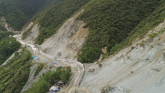 山路上的建筑 菲律宾 吕宋危险推土机水泥挖掘机拖拉机石头机械工作障碍土地图片