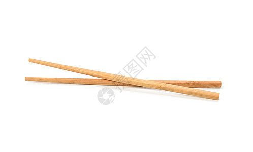 一对在白色背景上被孤立的木筷子用具竹子工具传统棕色食物木头文化工作室寿司图片