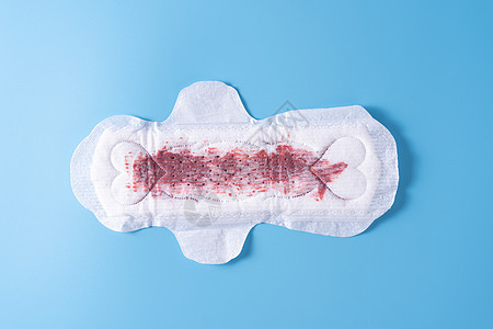 用过的卫生巾 蓝色背景的卫生巾 月经 女性卫生 顶视图图片
