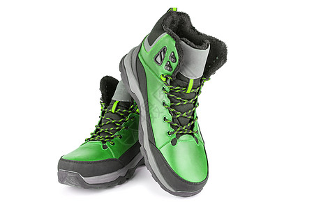 二对绿色绝缘的 冬季温暖 三季度运动鞋或靴子 在白色背景上隔离运动蕾丝鞋带皮革磨损鞋类远足季节大底旅行图片