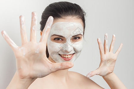脸部皮肤护理作物风景上的黑褐色梳洗霜奢华面具程序奶油身体沙龙治疗肤色黏土成人图片