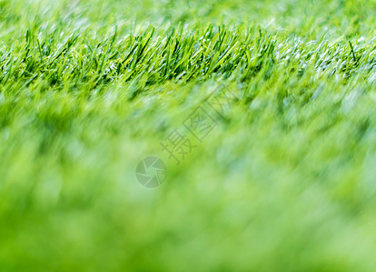 浅景深校园塑料人造草的质地闲暇草皮绿色颗粒娱乐地面草地足球操场天文图片