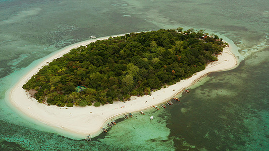 有沙滩的热带岛屿 菲律宾曼蒂格岛旅行晴天景观游客海岸线蓝色海景海湾鸟瞰图理念图片