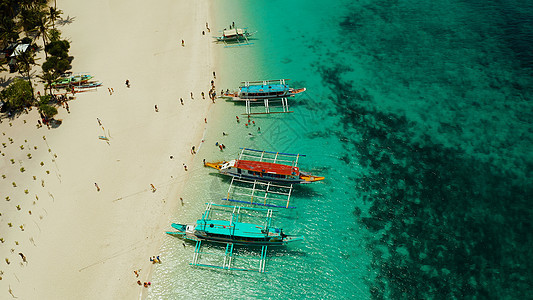 热带热带海滩和绿松石环礁湖水理念游客天空岛屿奢华海湾假期海岸线海景海岸图片