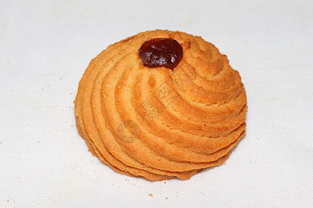 白桌布宏上的短面包饼干白色糕点棕色小吃甜点蛋糕巧克力早餐图片