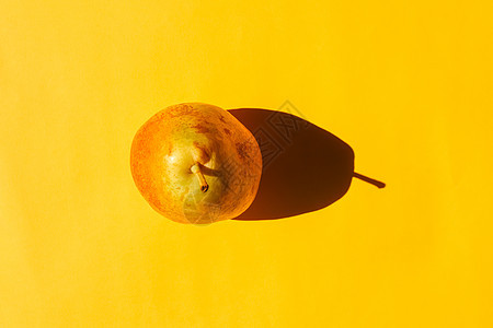 平面背景上有硬阴影的梨子 从顶部视图 用于图案的空白彩色水果工作室照片空间视角烹饪平铺健康植物图片