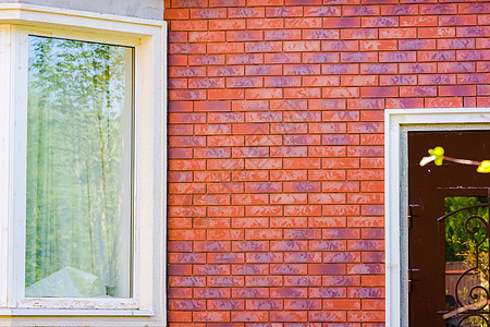 完成房屋外墙的焦热热板面板材料石墙石工瓦工涂层水泥砖墙熟料橙子建筑图片