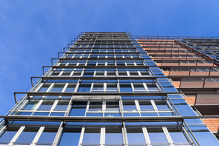 现代办公楼立面 玻璃和窗户反射阳光建筑学摩天大楼中心建筑物蓝色公司金融城市建筑办公室图片