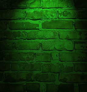 绿色霓虹灯创辉框架中的照明砖墙背景图片