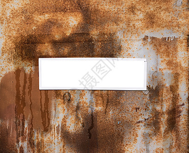 生锈的棕色金属板背景上的空白框图片